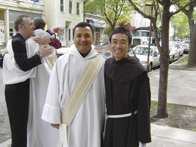 BROTHER DUC Pham (at right), celebrates a milestone in the road toward priesthood for Juan Carlos Ruiz Guerrero, who is now an ordained member of the Franciscan order.