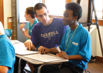 &ldquo;If everyone in the U.S. took one week out of the year to volunteer and serve others in some way, so many of the problems that burden America would be solved,&rdquo; says Chris, a volunteer from Carroll College in Helena, Montana, seen helping a student with math at Hope Hall. 