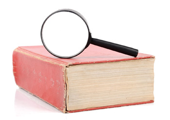 dictionary with magnifying glass