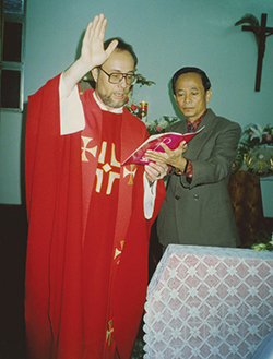 John Chang, the catechist at She-tze, helps Father Daniel J. Bauer, S.V.D. at a wedding.