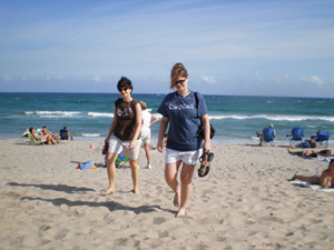 Sister Leslie Keener, C.D.P. and Sister Katy LaFond, O.S.F. stroll the beach during a gathering of sisters in their 20s and 30s. 