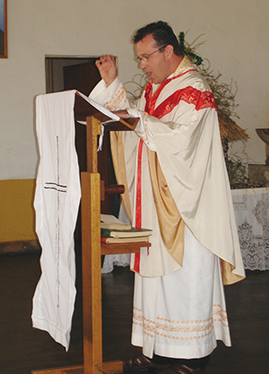 Father Dermot, who is in demand as a speaker and preacher, proclaims the gospel during Mass.