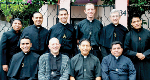 Father Matt (back row, third from left) with other members  of his Holy Cross community.
