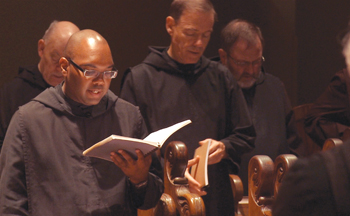 Brother Patrick Winbush, O.S.B. prays with other monks of his Newark Abbey  community. 