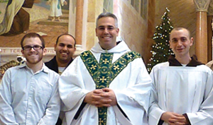 Father Michael (center) after Mass with a group of young men who attended a “come & see” weekend at the Discalced Carmelite Friars’ Marian Shrine, Holy Hill, Wisconsin. From left: Alex Swetz (Ohio), Rolando Reyes (Florida), and Frank DiVito, a novice with the Discalced Carmelite friars of the Washington Province.