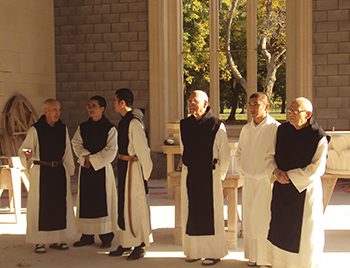 The monks gather inside the new church during the rebuilding process.