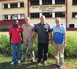 The team of brothers (above) who have poured themselves into rebuilding the Amatongas Catholic school in front of the refurbished building.