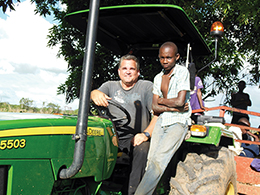 Brother Chris loves his morning tractor ride, which always brings children running out of their homes to greet him. 