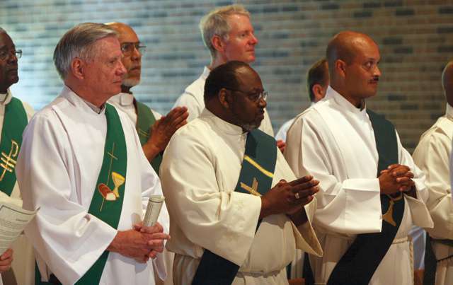 Permanent deacons worship at a Josephite-led Mass