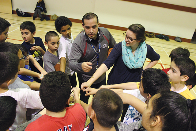 rother Roberto Martinez, F.S.C. volunteers coaching De Marillac Academy’s sixth-grade boys basketball team