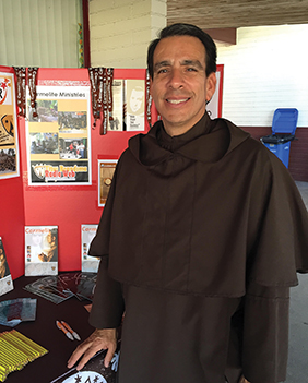Henson takes part in a vocation fair as part of his ministry.