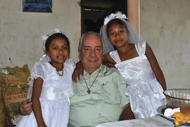 Pictured here is Father Bragotti with two girls from San Luis Petén Parish in Guatemala in 2008. 