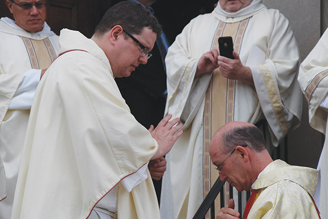 The author, Father Douglas-Adam Greer, O.P., extends a blessing.