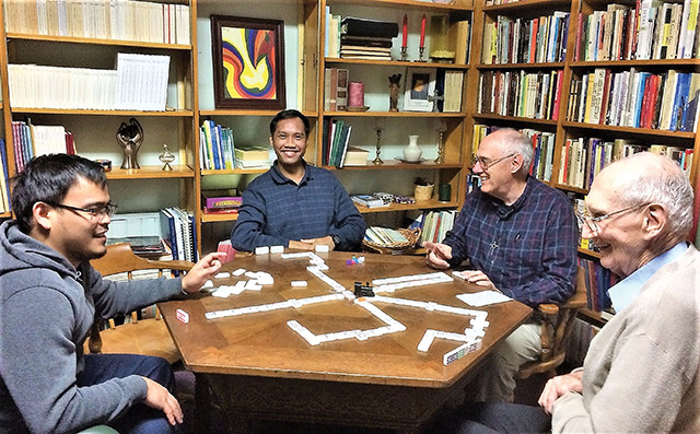 Brothers of the Sacred Heart play a game of dominos