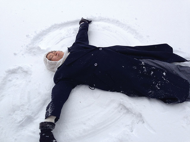 A Sister of St. Mary of Oregon makes a snow angel
