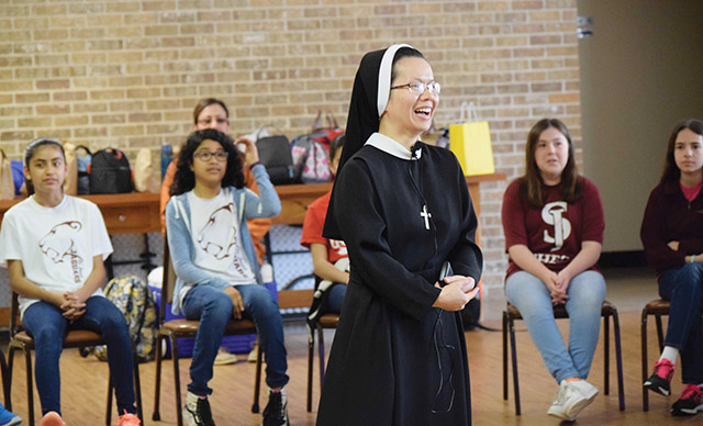 Sister Emmanuela Le, C.S.F.N. leads a retreat at Nazareth Retreat Center for young women reflecting on their vocation. 