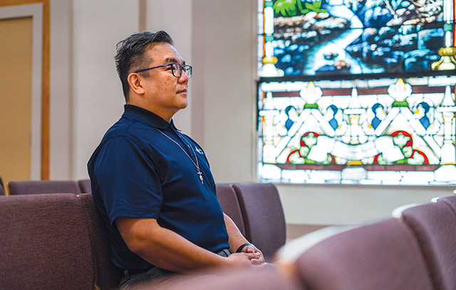 Br. Pacquing spends a quiet moment in the chapel at St. Mary’s University.