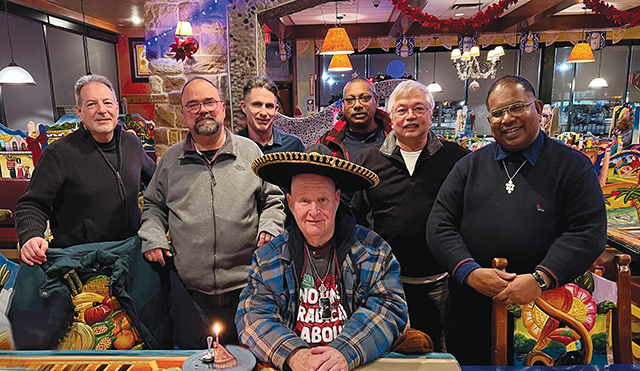 A group of brothers celebrate the birthday of Brother Daniel McCormick, C.F.A. 