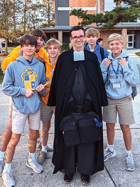 Brother Javier Hansen, F.S.C. with students at St. Paul School in Covington, Louisiana where he teaches religion.
