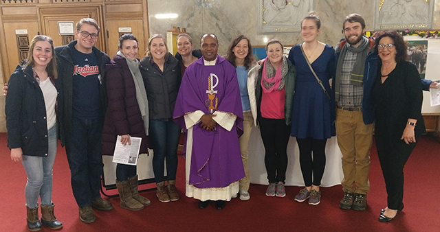 Munishi with Duquesne University students who visited his Baltimore parish to learn about and assist with the Spiritan ministry there.