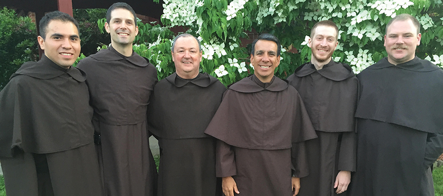 Father Paul Henson, O.Carm. (center right) with some of the men who entered his community in recent years.