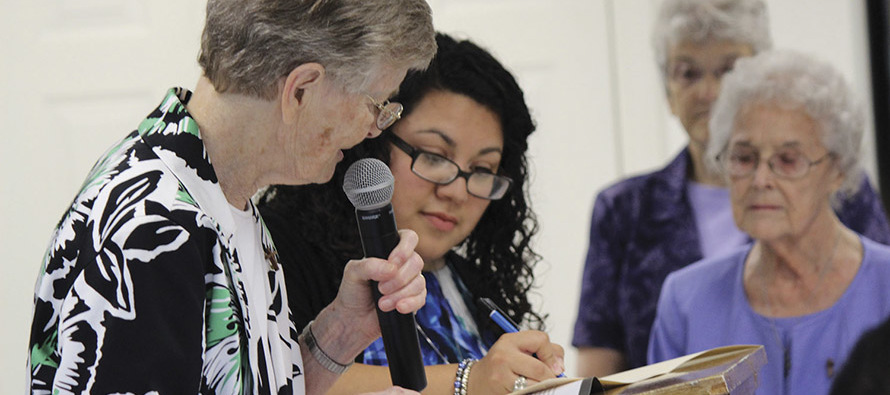 Sister Ann Petrus, C.D.P., superior general of the Congregation of Divine Providence (left), welcomes Sister Christina Chavez, C.D.P. as a member in July 2016. 