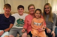 Sister Renée Daigle, M.S.C. visits with four of her six godchildren.
