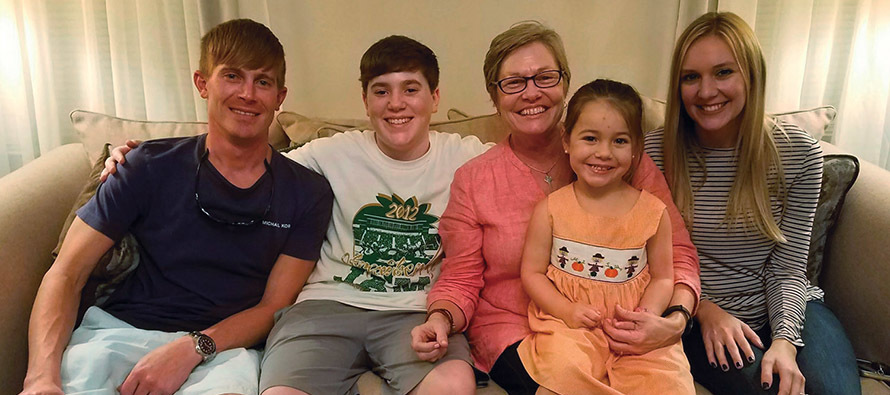 Sister Renée Daigle, M.S.C. visits with four of her six godchildren.