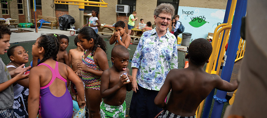 Sister Tesa Fitzgerald, C.S.J. with children from Hour Children in Queens, NY.