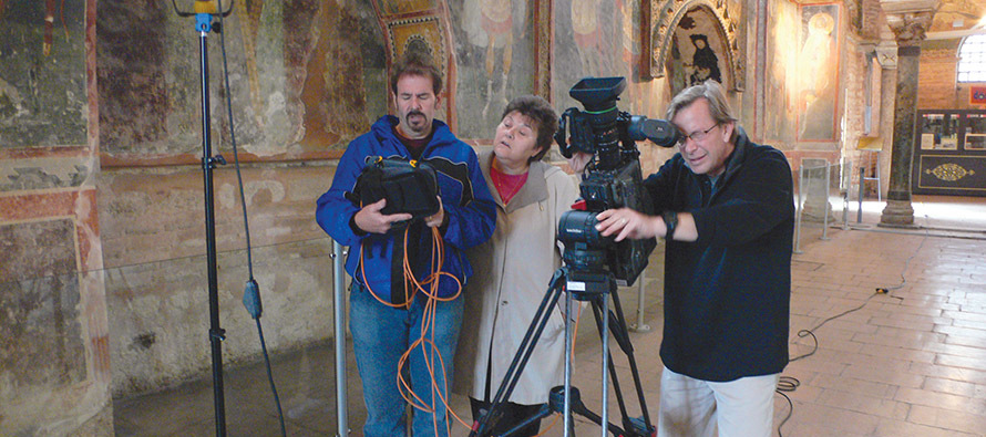 Sister Judy Zielinski, O.S.F. works with a crew filming murals in a church near Istanbul. 